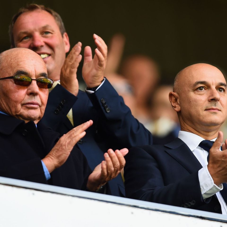 Joe Lewis and Daniel Levy sit together at a Tottenham match, applauding.