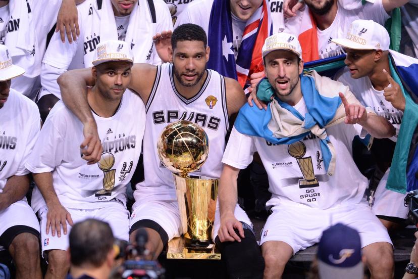 Tony Parker, Tim Duncan, and Manu Ginobili celebrate winning the 2014 NBA Championship.