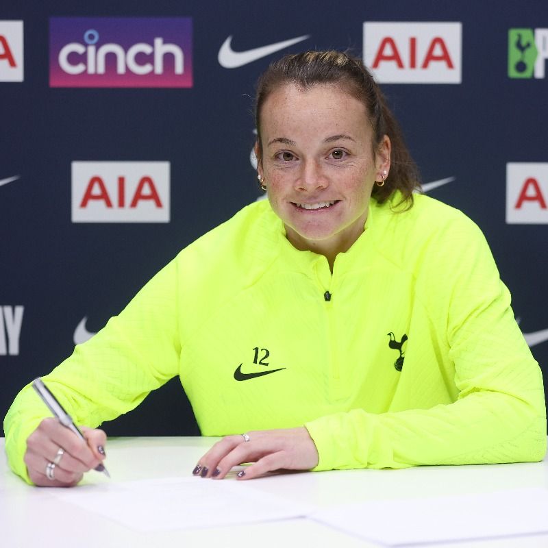 Ria Percival signs her new contract.