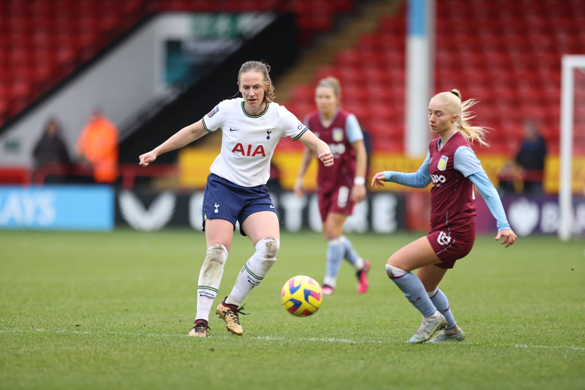 Kerys Harrop battles to win the ball with Aston Villa's Laura Blindkilde Brown