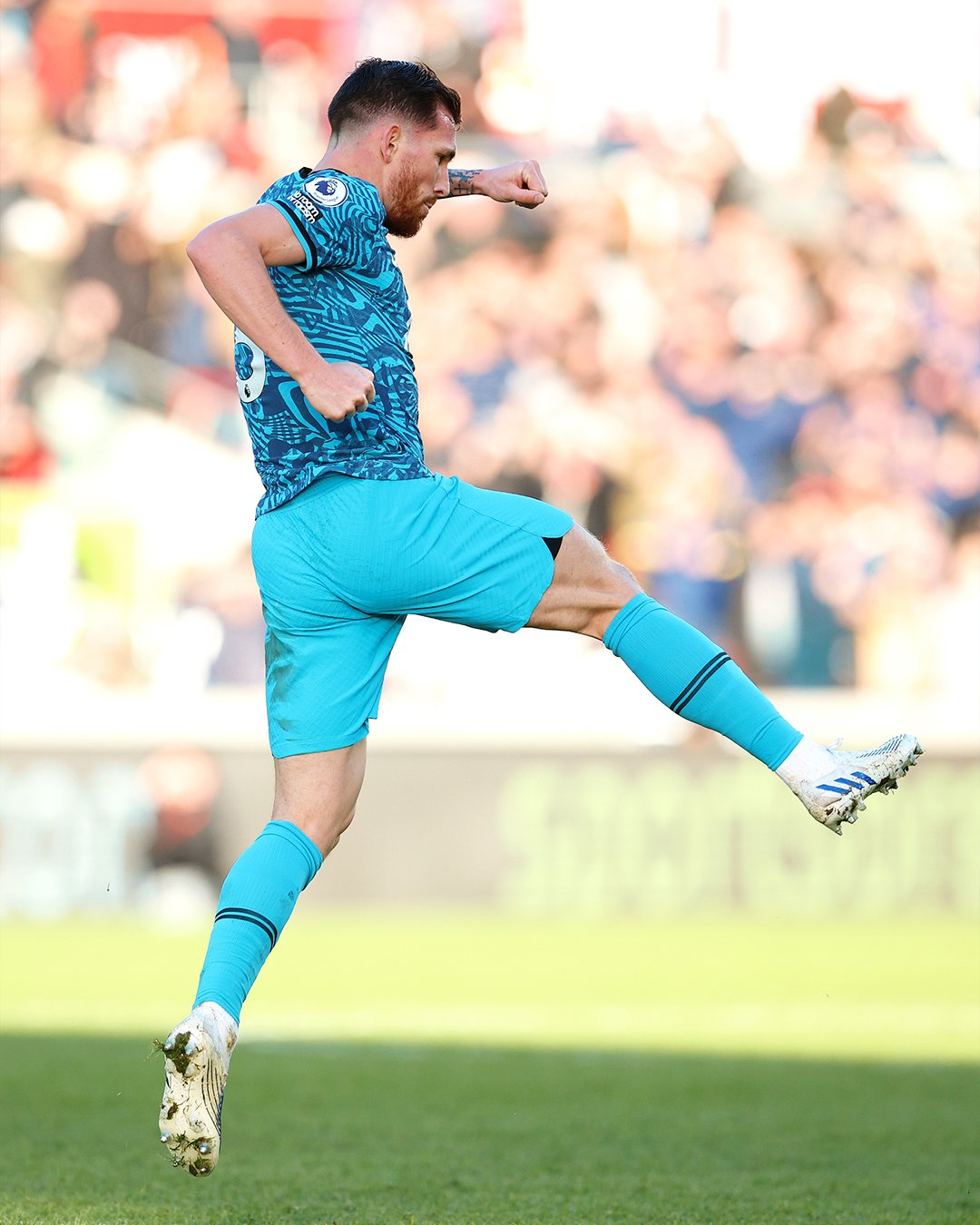 Pierre-Emile Højbjerg leaps into the air to celebrate after scoring a goal