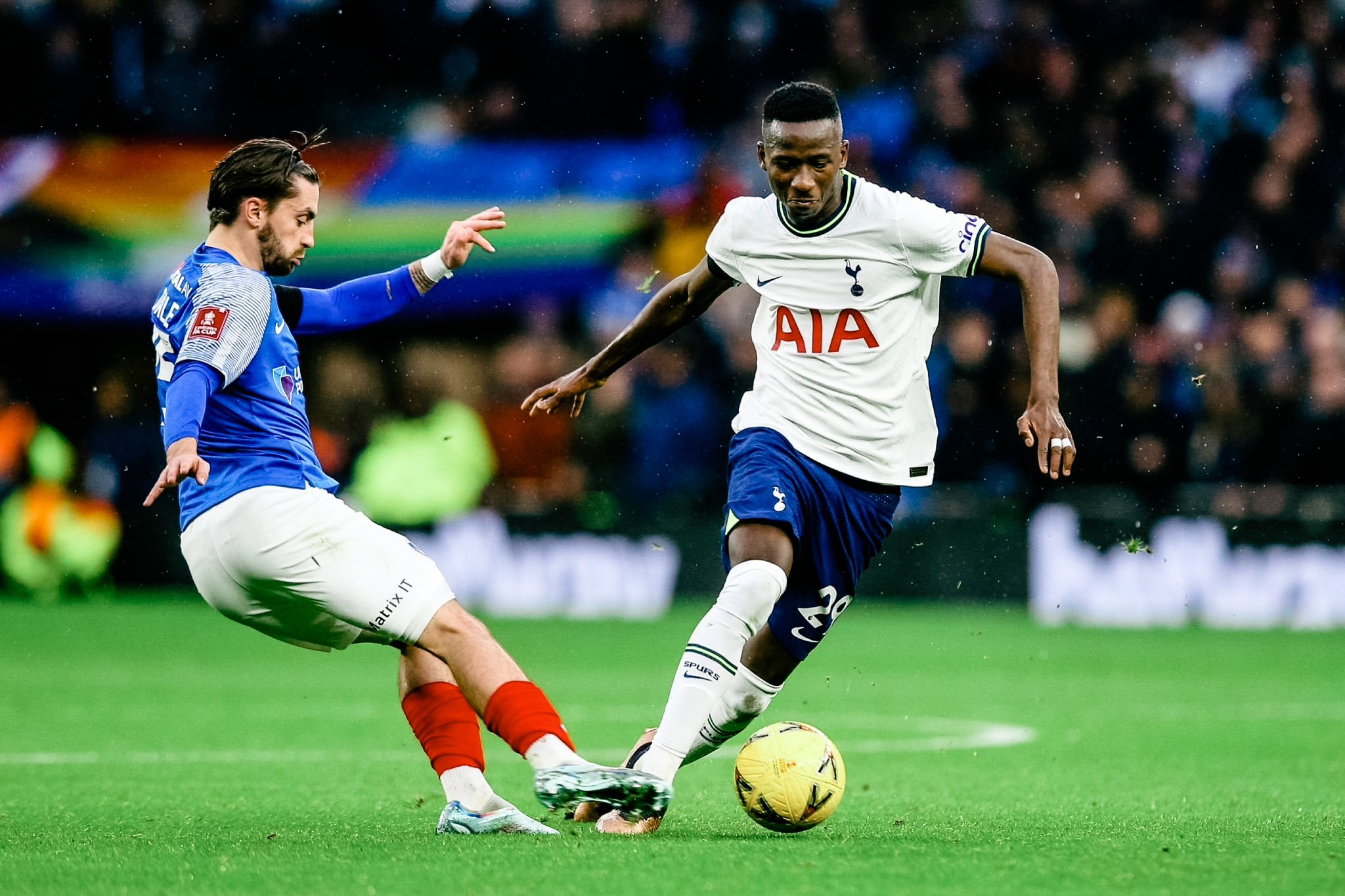 Pape Sarr dribbles past a Portsmouth player