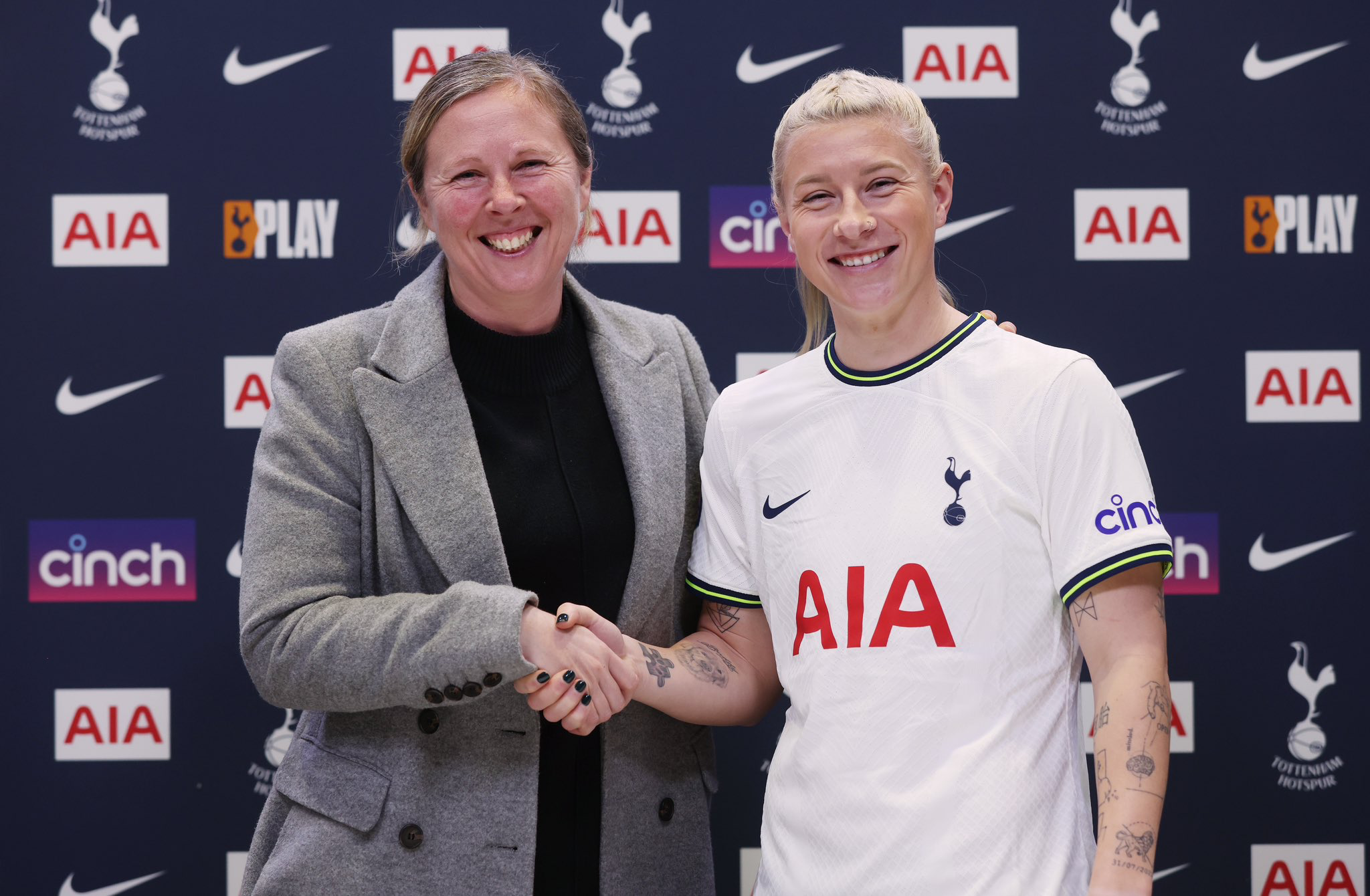 Rehanne Skinner and Beth England shake hands at the announcement of England's signing for Spurs