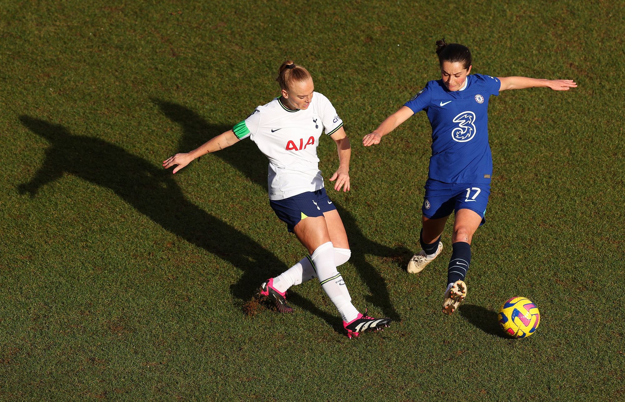 Molly Bartrip passes the ball past Jessie Fleming