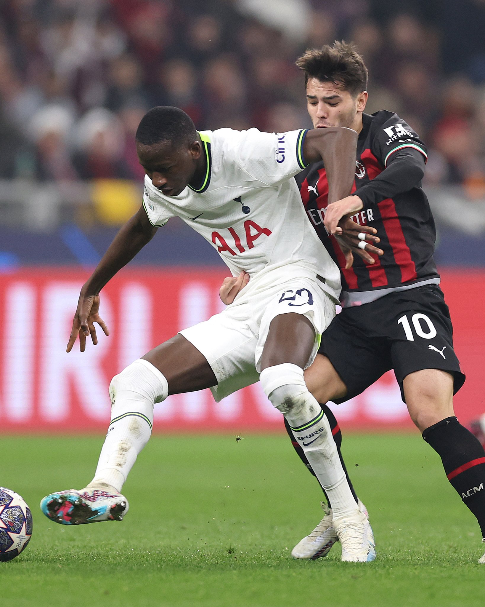 Pape Sarr shields the ball from Brahim Díaz.