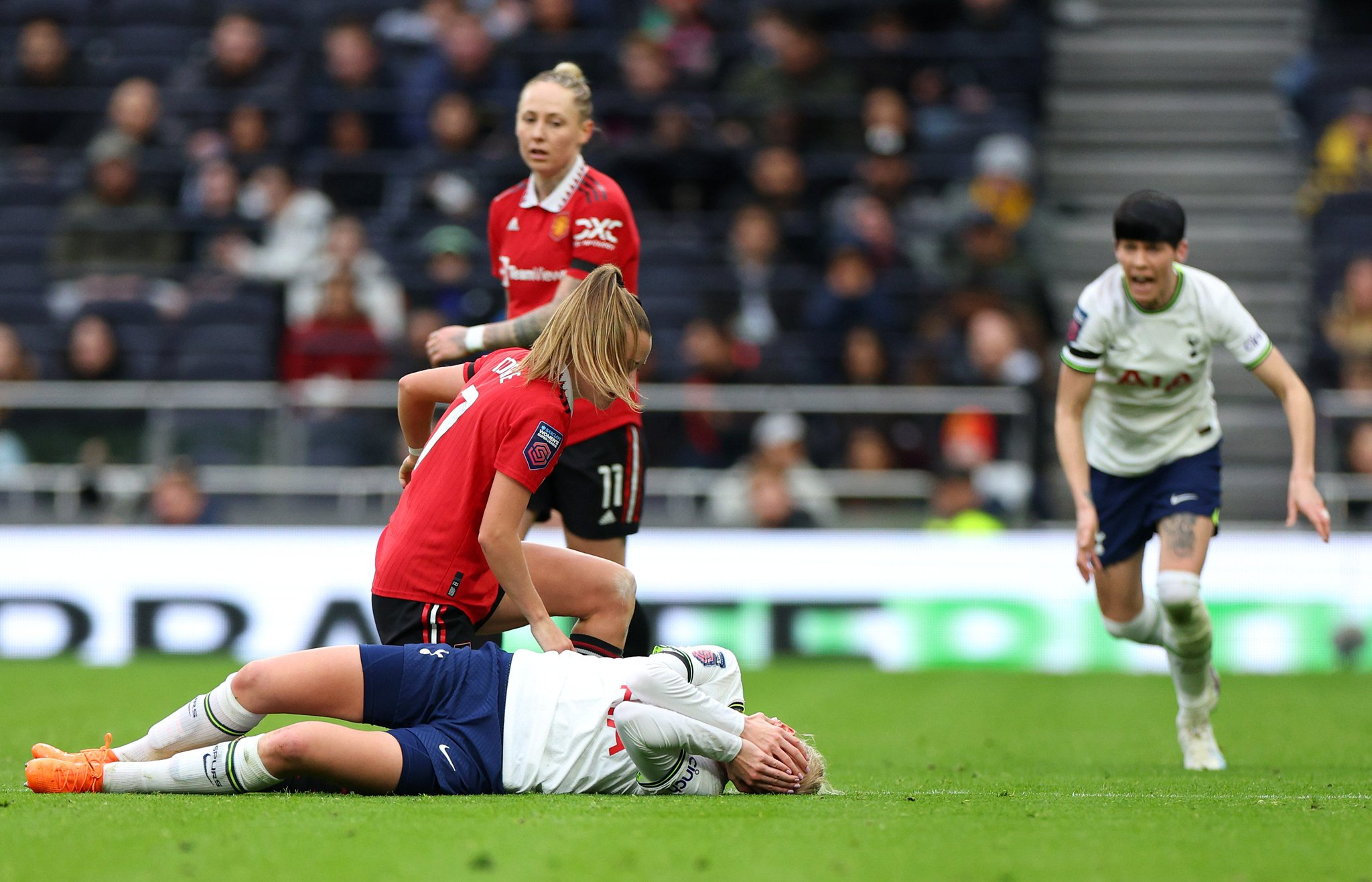 The aftermath of Ella Toone's red card shove on Eveliina Summanen. Leah Galton and Ash Neville look on in the background.