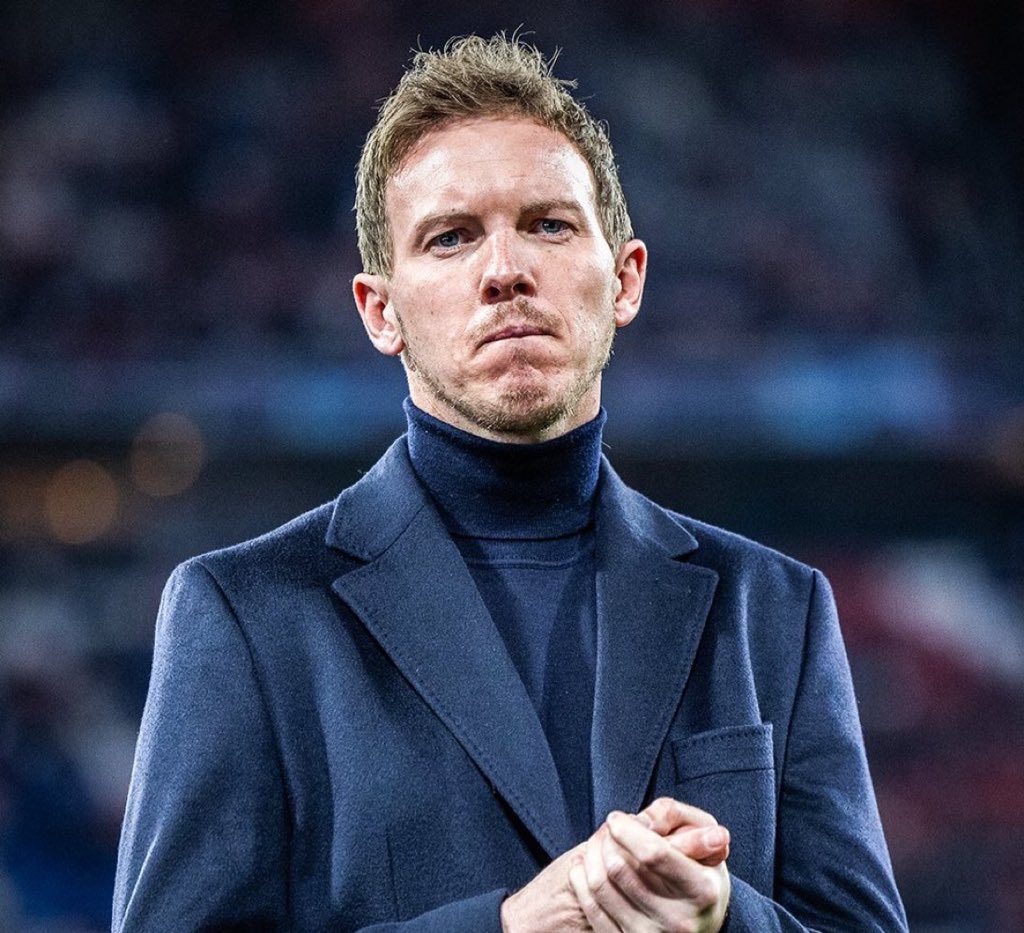 Julian Nagelsmann in a monochromatic outfit of turtleneck and knit suit jacket.