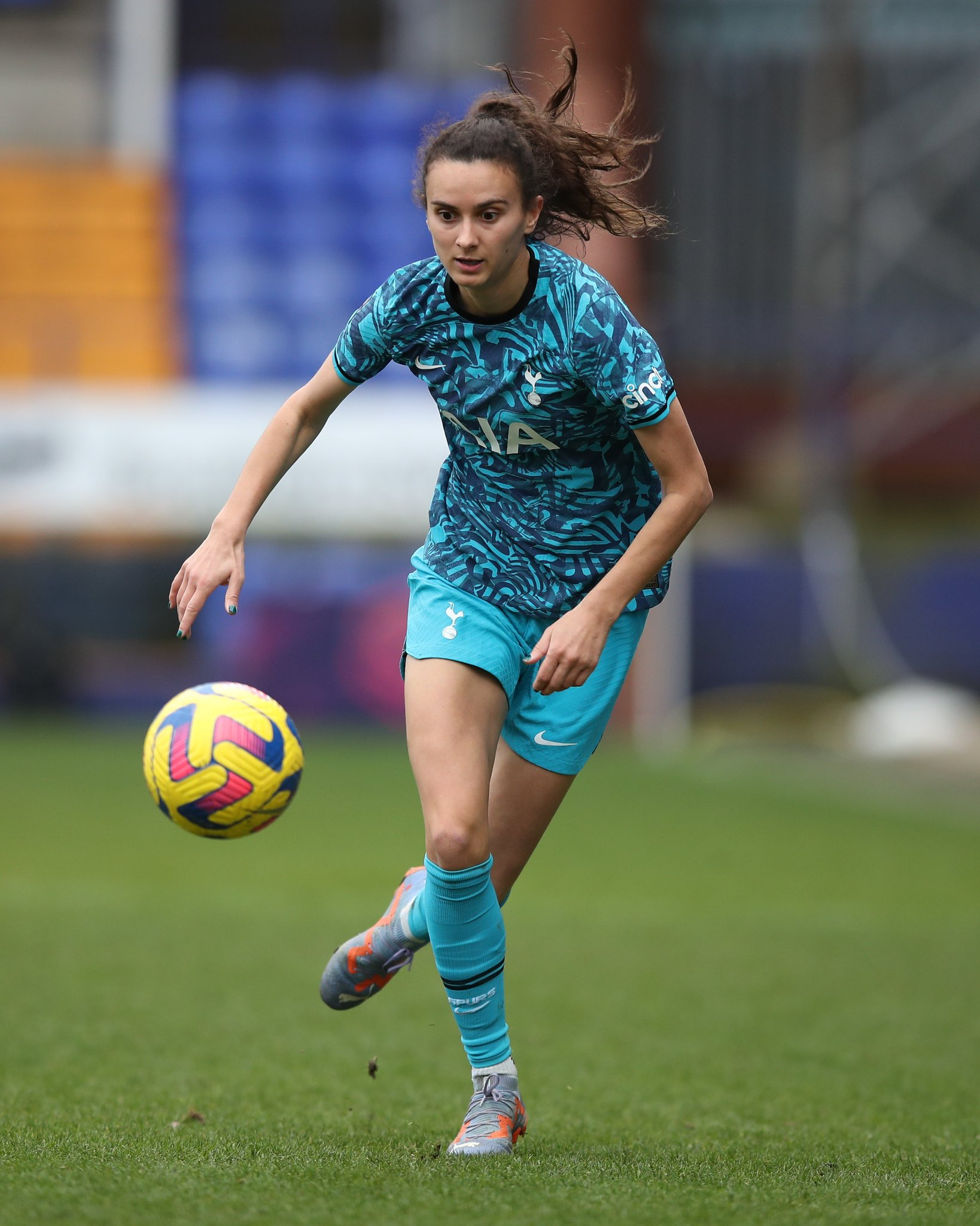 Rosella Ayane dribbles the ball during Spurs's match at Liverpool.