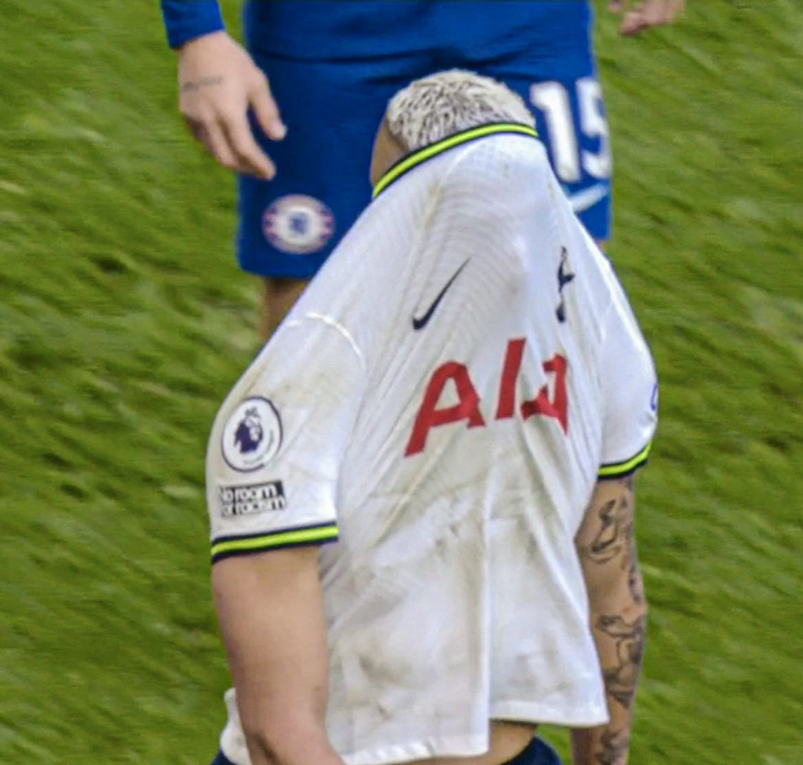 Richarlison covers his face with his jersey in frustration during a recent game.