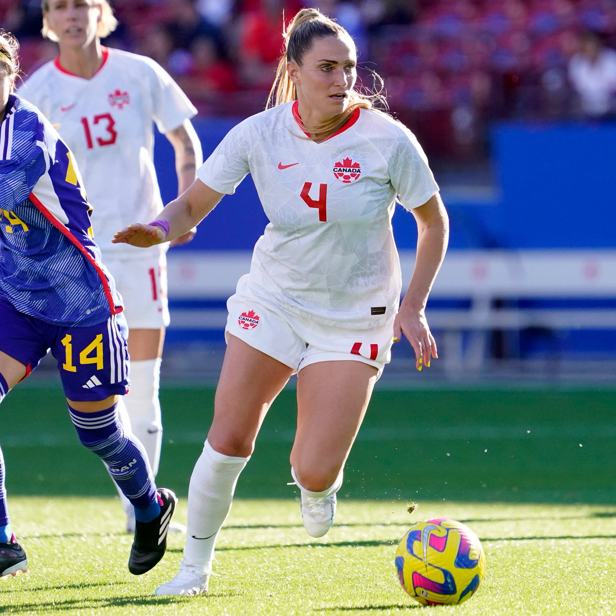 Shelina Zadorsky dribbles the ball in Canada's match against Japan.