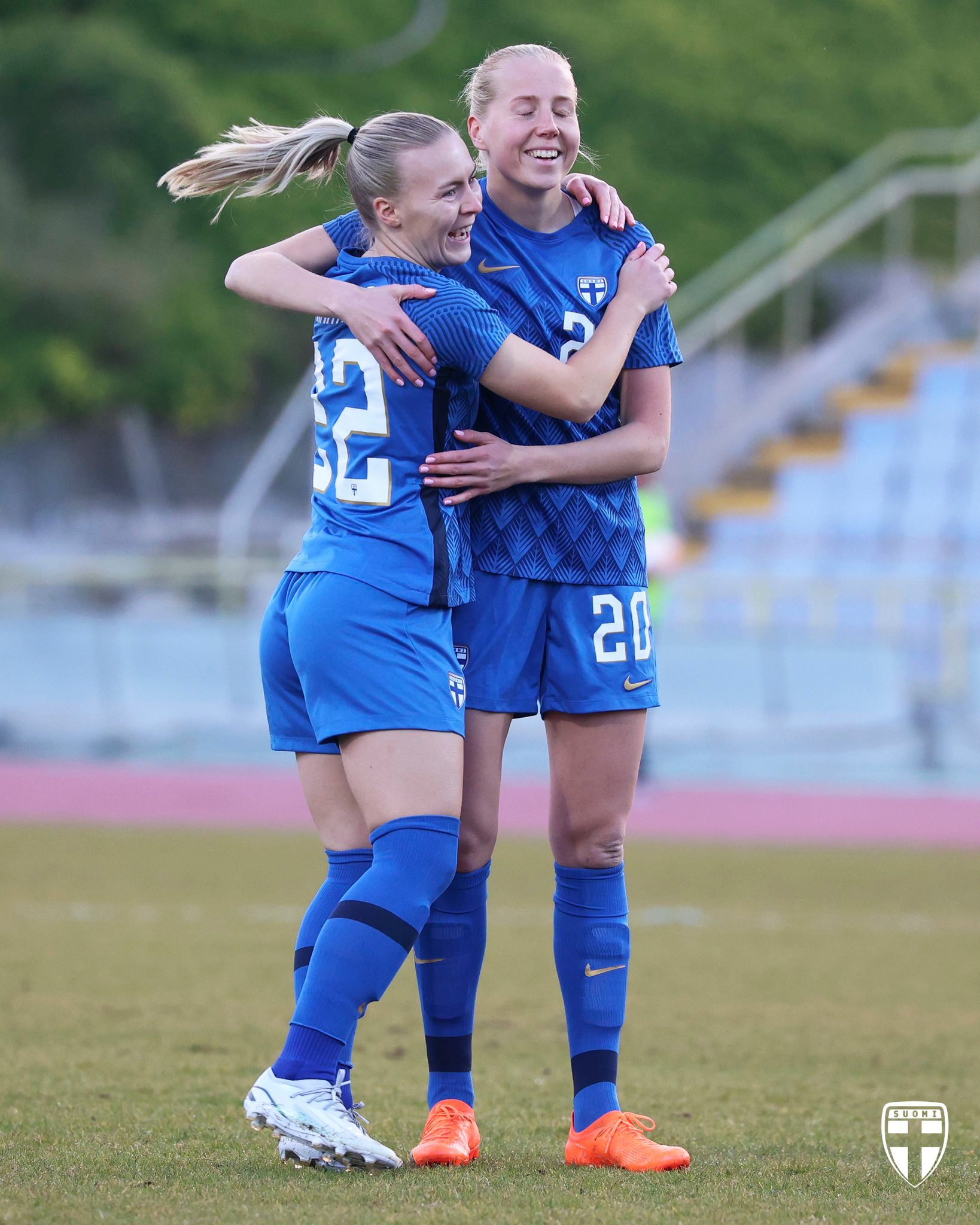 Eveliina Summanen celebrates a goal with one of her Finland teammates