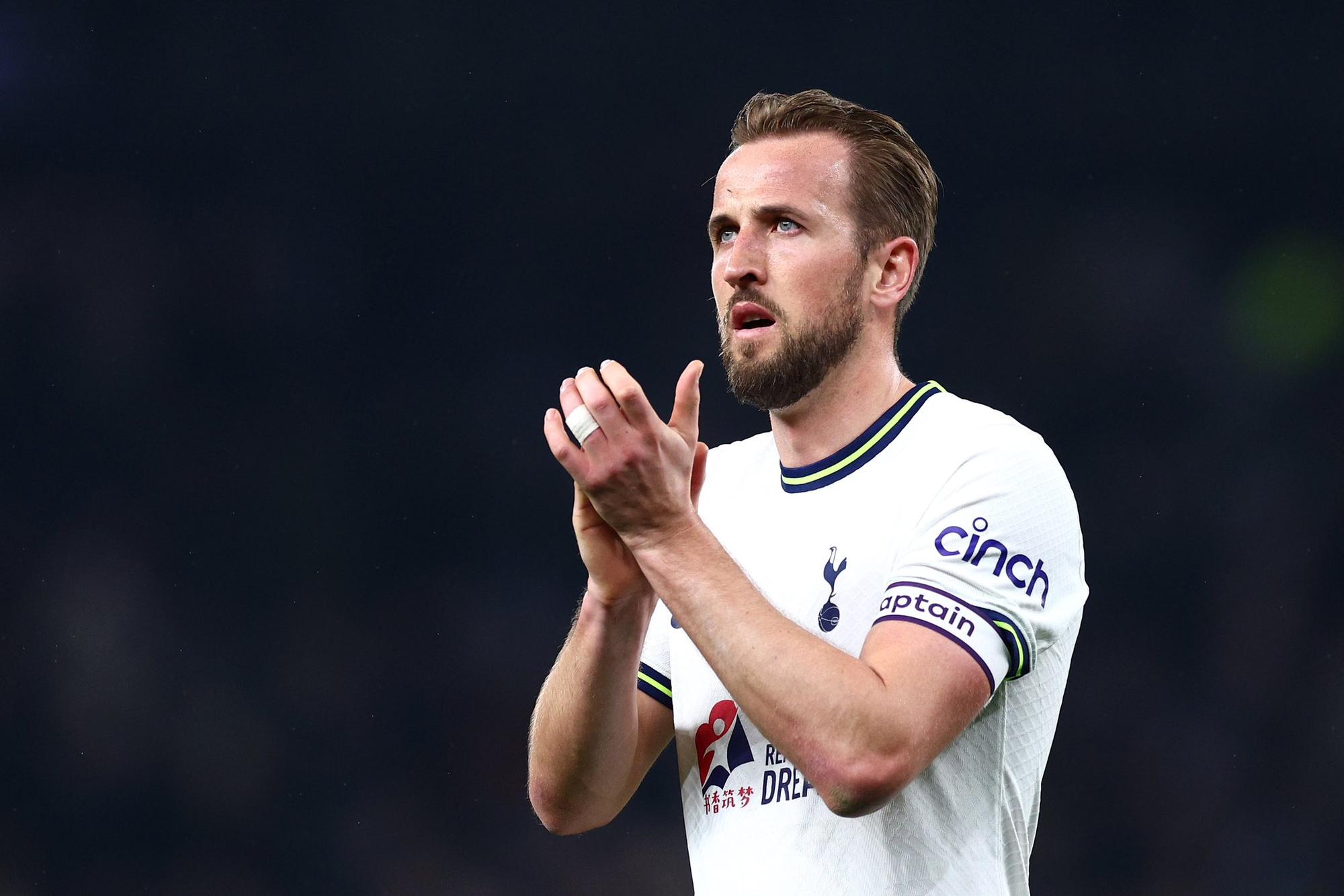 Harry Kane applauds the fans after the draw against Manchester United.