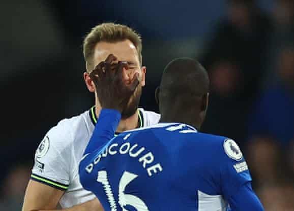 Everton's Abdoulaye Doucouré comes dangerously close to an eye gouge on Harry Kane.