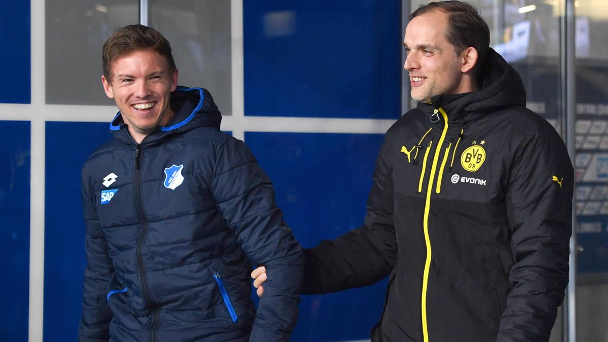 Thomas Tuchel holds the arm of his former protégé and current competitor, Julian Nagelsmann.