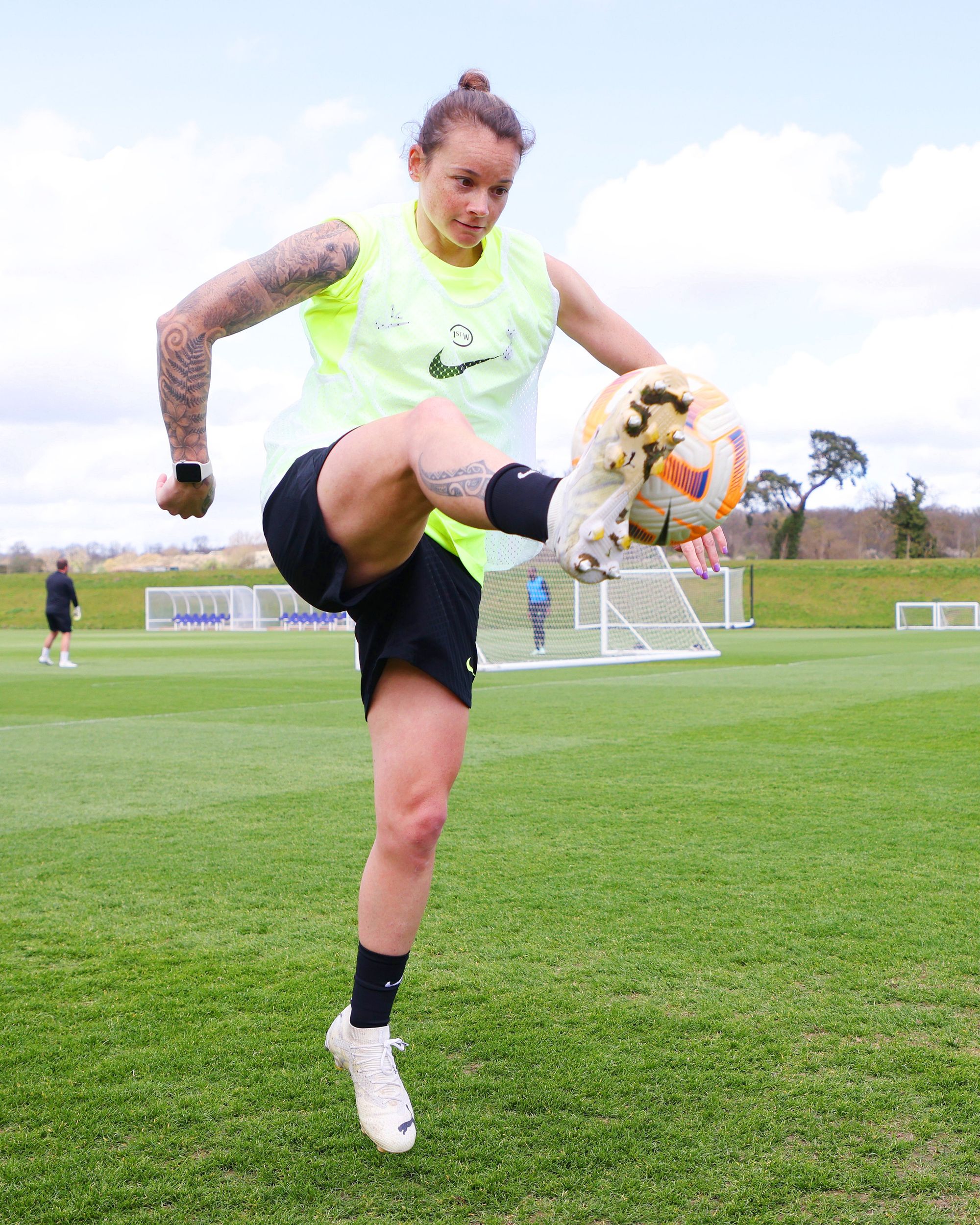 Ria Percival extends her leg high to capture a ball in training.