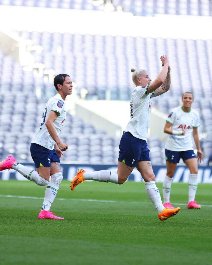 Beth England celebrates a goal against Brighton.