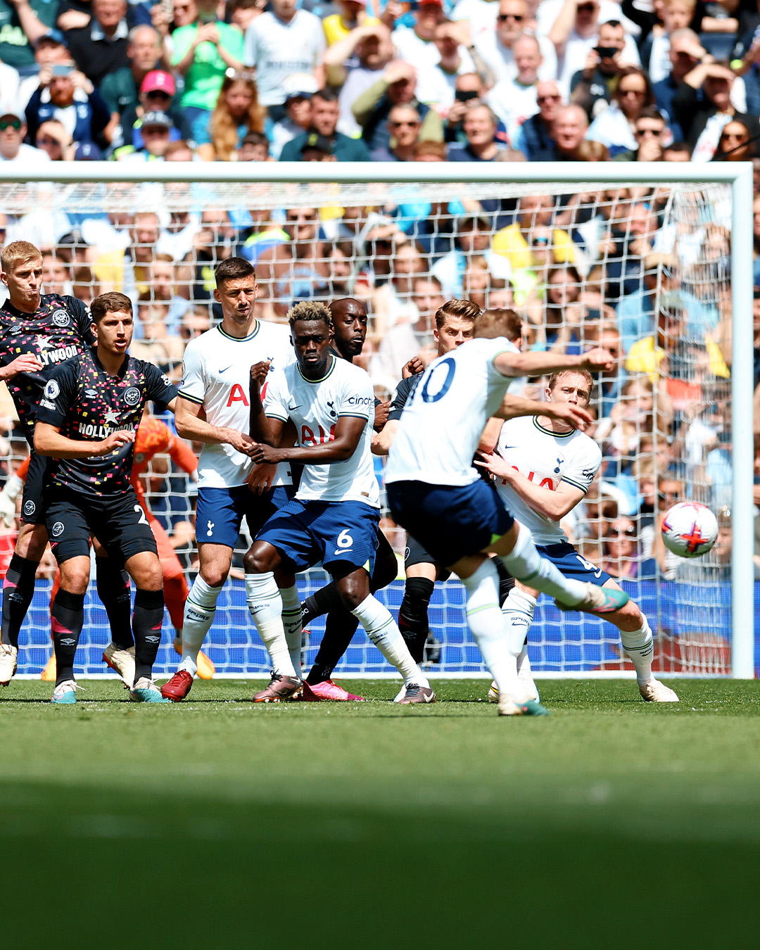 Harry Kane scores from a free kick.