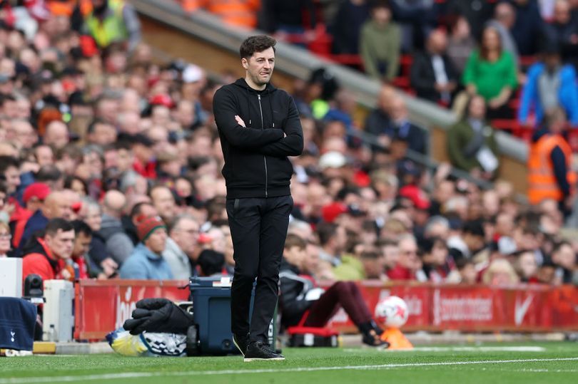 Ryan Mason looks on from the touchline during the match at Liverpool.