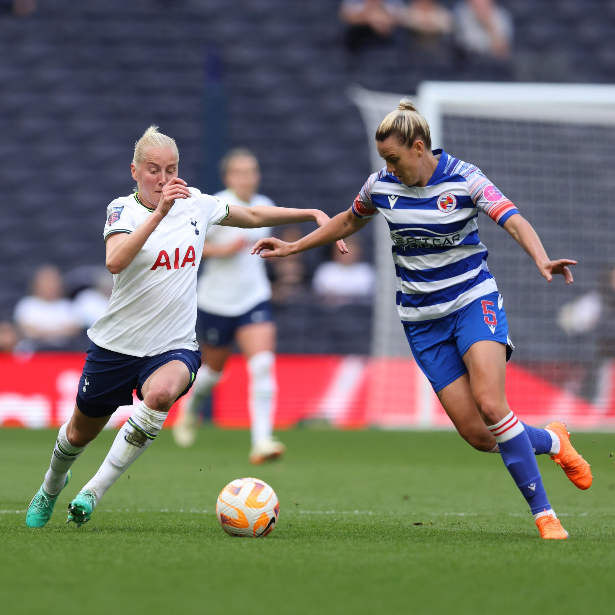 Eveliina Summanen fights for possession with Reading's Gemma Evans.