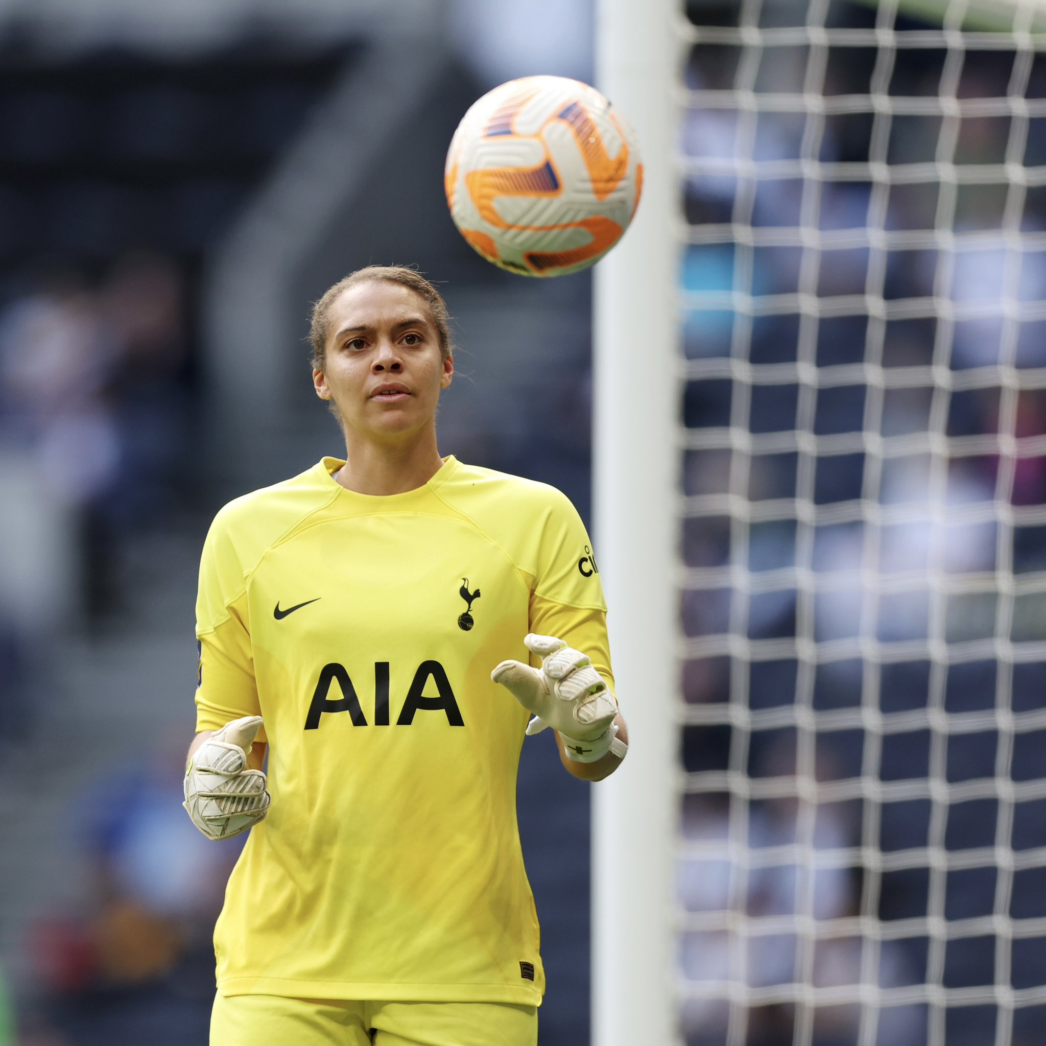 Becky Spencer stands ready to receive a ball near the goal.