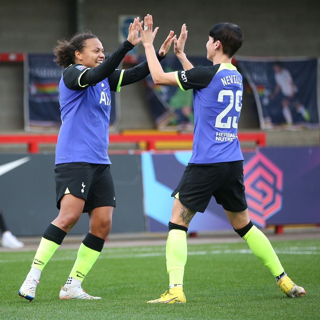 Drew Spence and Ash Neville high five during the Brighton blowout.