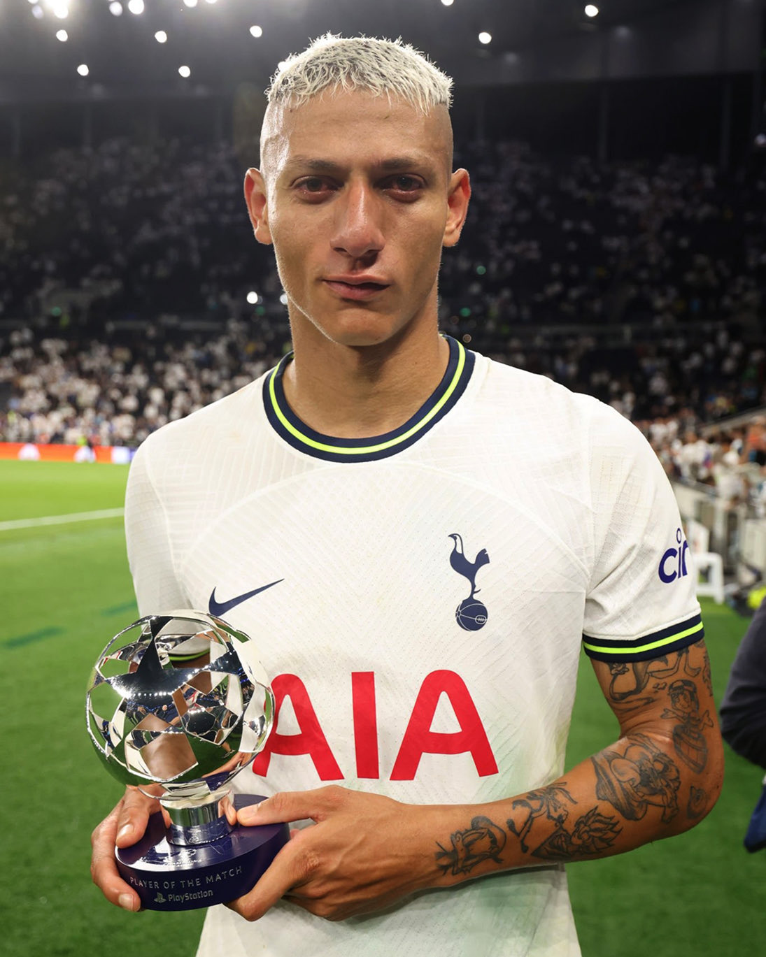 Richarlison tearfully smiles after accepting his Champions League Player of the Match award.