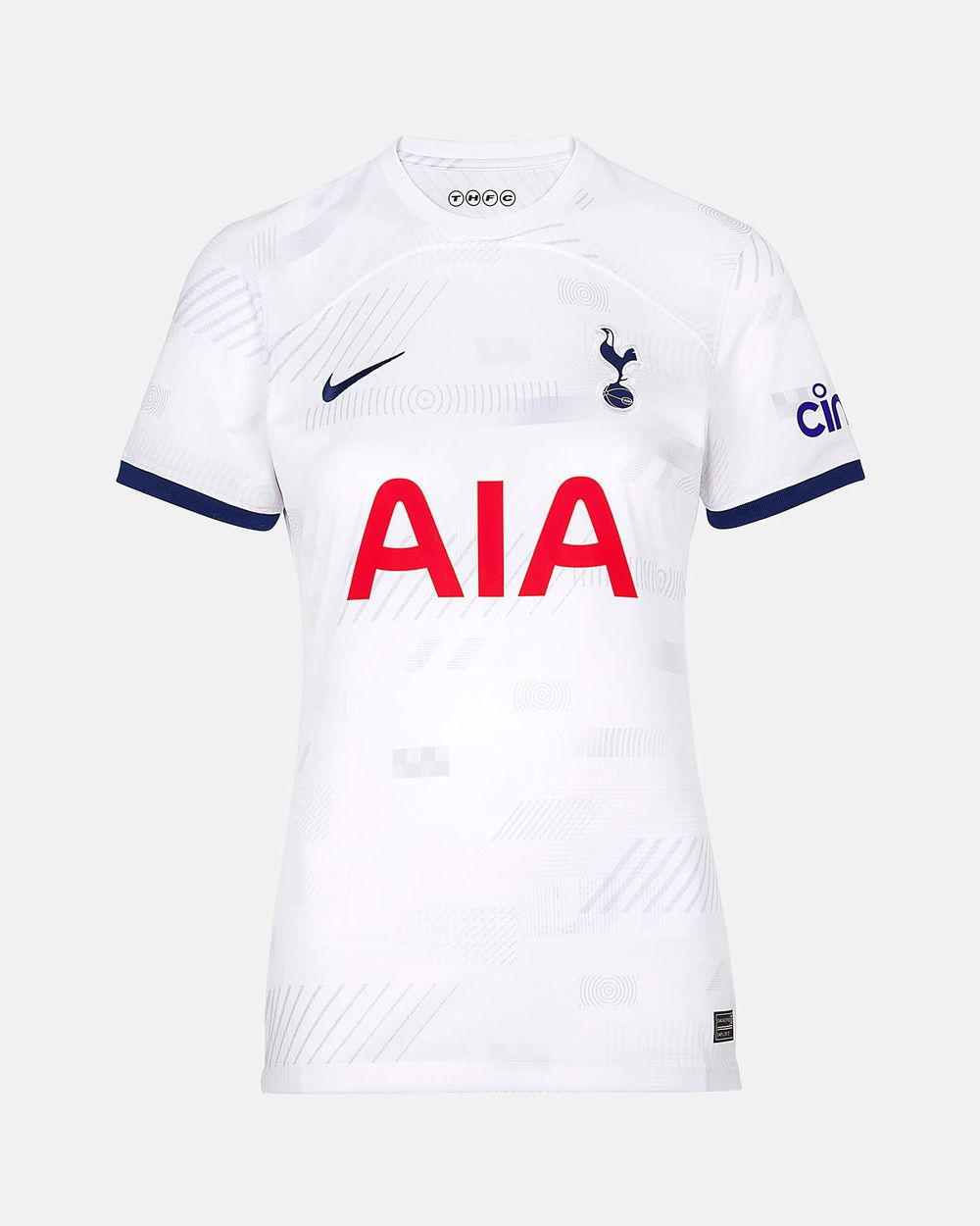 The new home kit, a white shirt with subtle geometric print and navy sleeve detail.