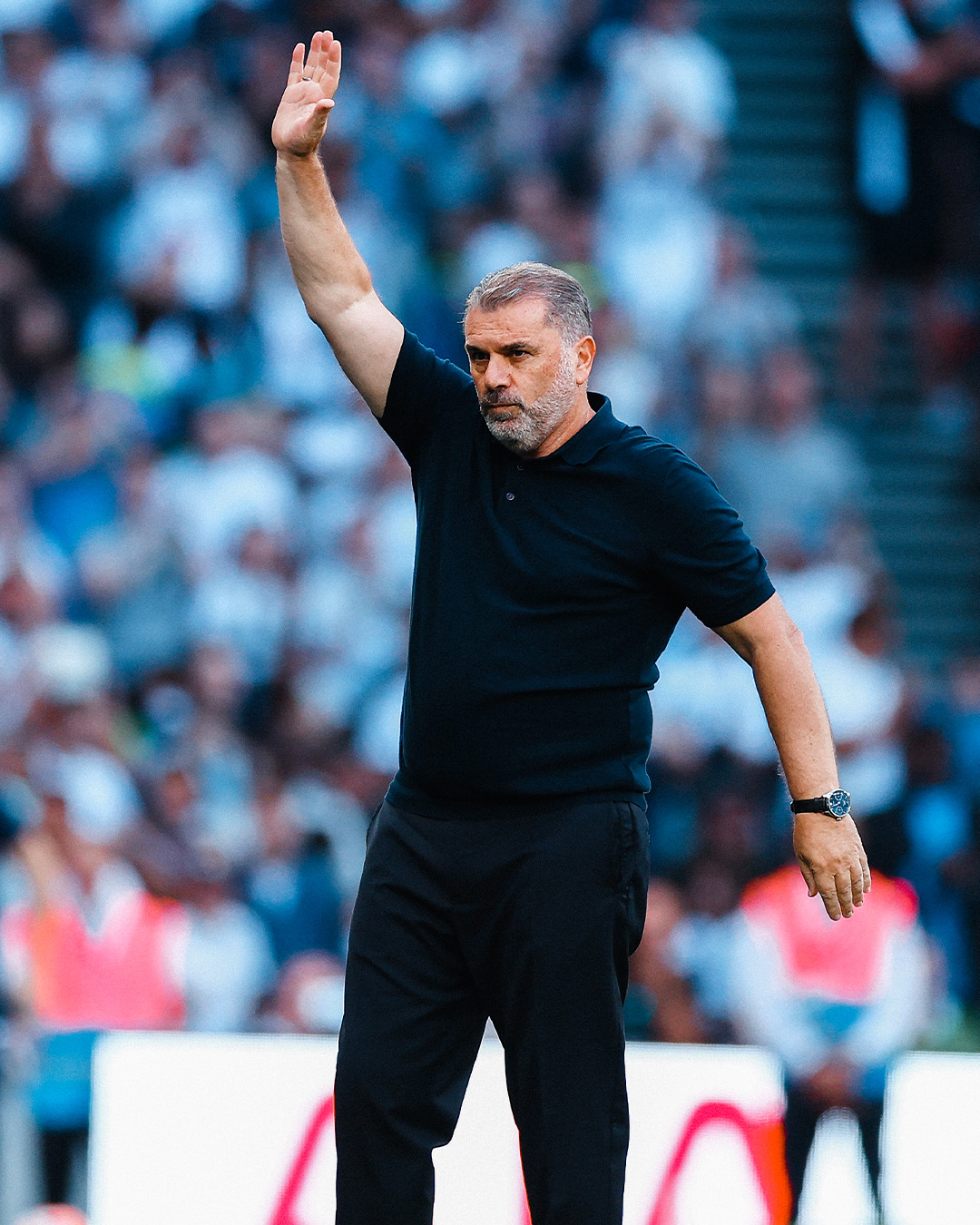 Ange Postecoglou waves at his first PL game at THS.