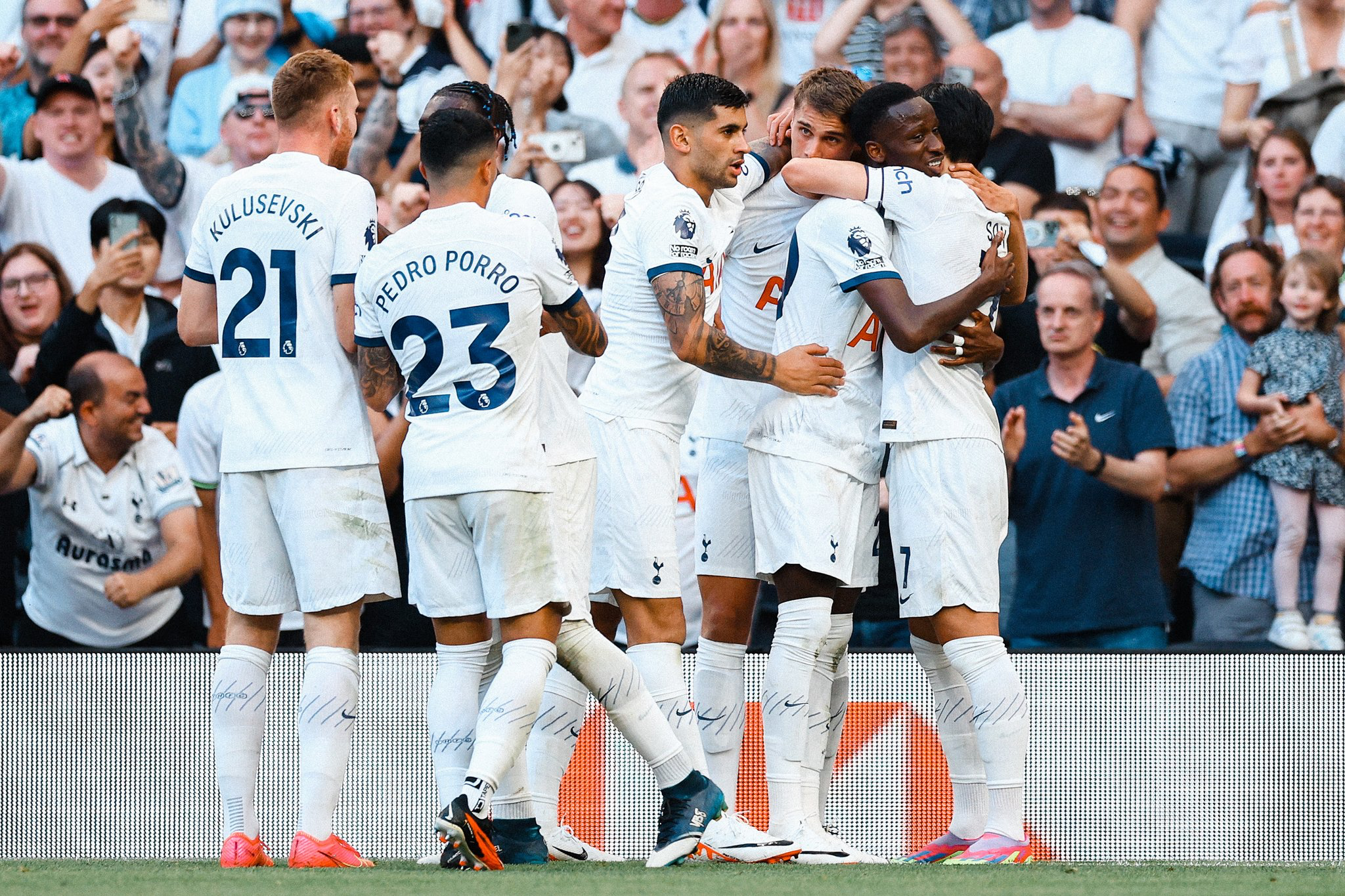 Pape Sarr celebrates his first Spurs goal with his teammates.