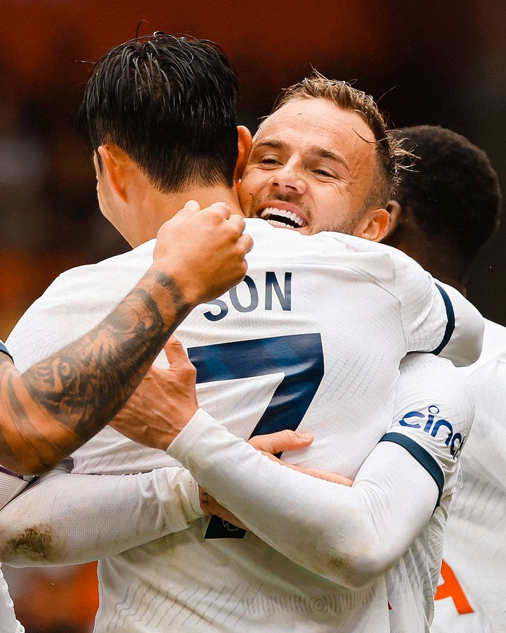 James Maddison hugs Son Heung-min while celebrating his goal.