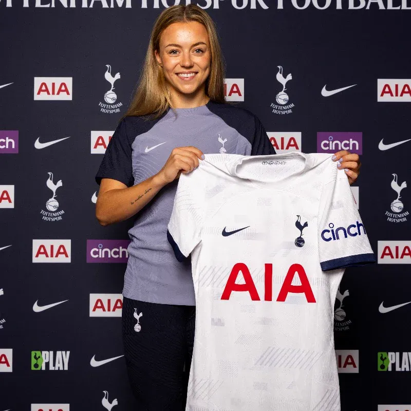 Olga Ahtinen holds up her new Spurs kit.