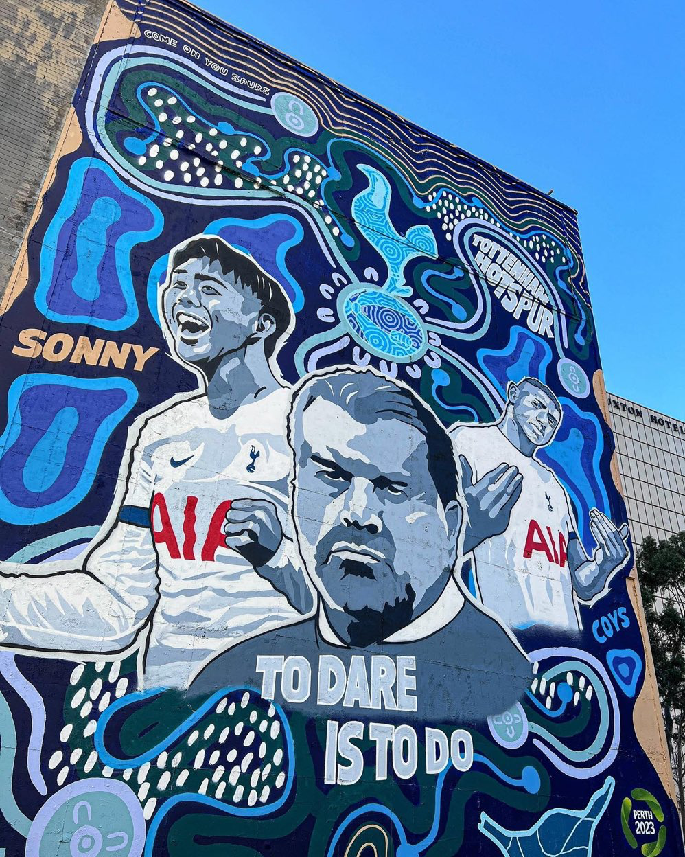 A Spurs mural featuring Son, Postecoglou, and Richarlison in Perth, painted in an Aboriginal style. 