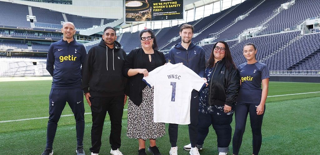 Ben Davies marks the signing of the Women's Night Safety Charter with other representatives of the club.