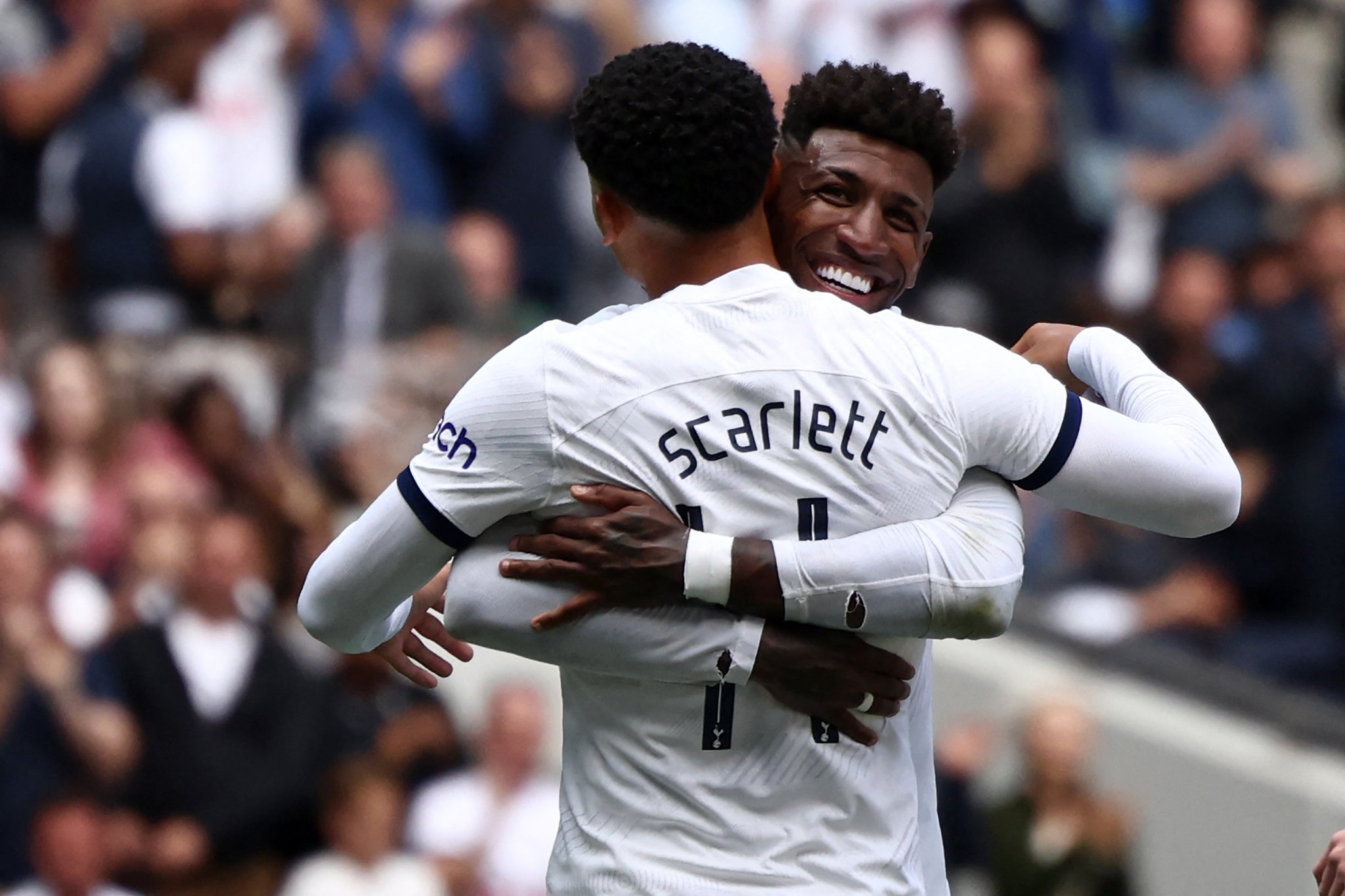 Dane Scarlett is hugged by Emerson Royal after scoring a goal in pre-season.