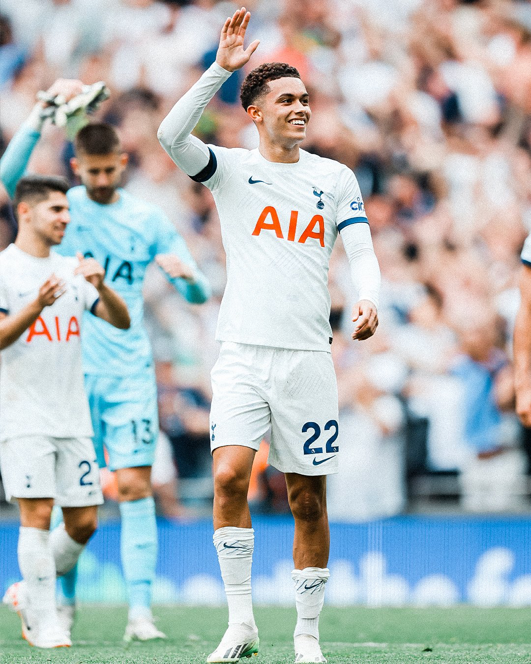 Brennan Johnson waves to fans after making his debut for Spurs.