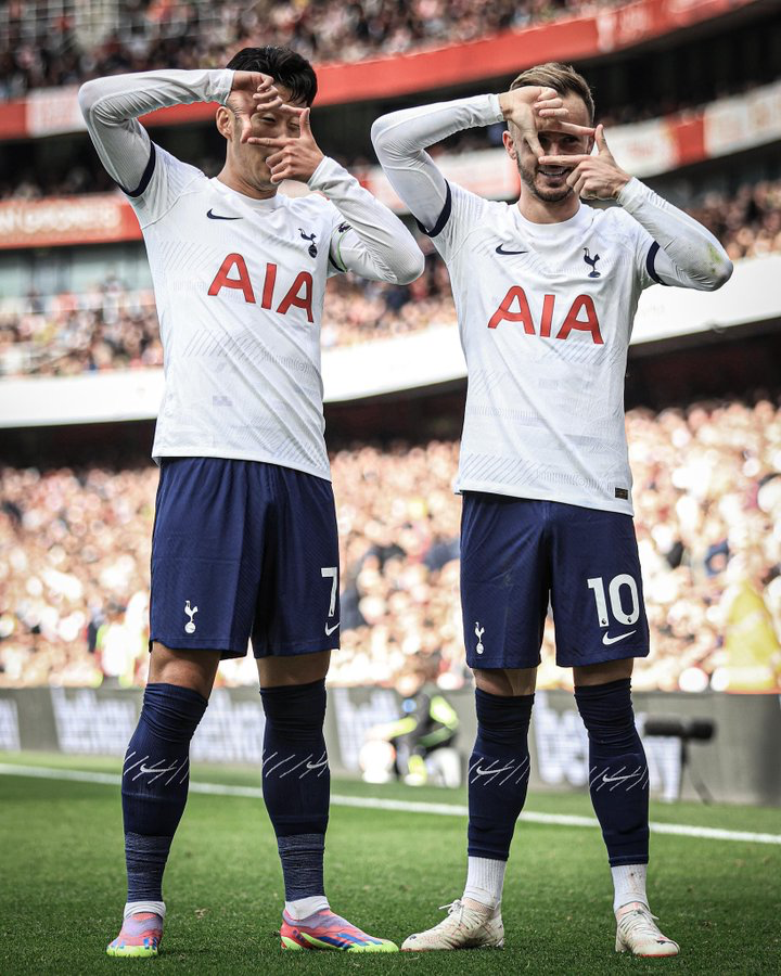 Son Heung-min and James Maddison do the former's signature goal celebration of a camera.