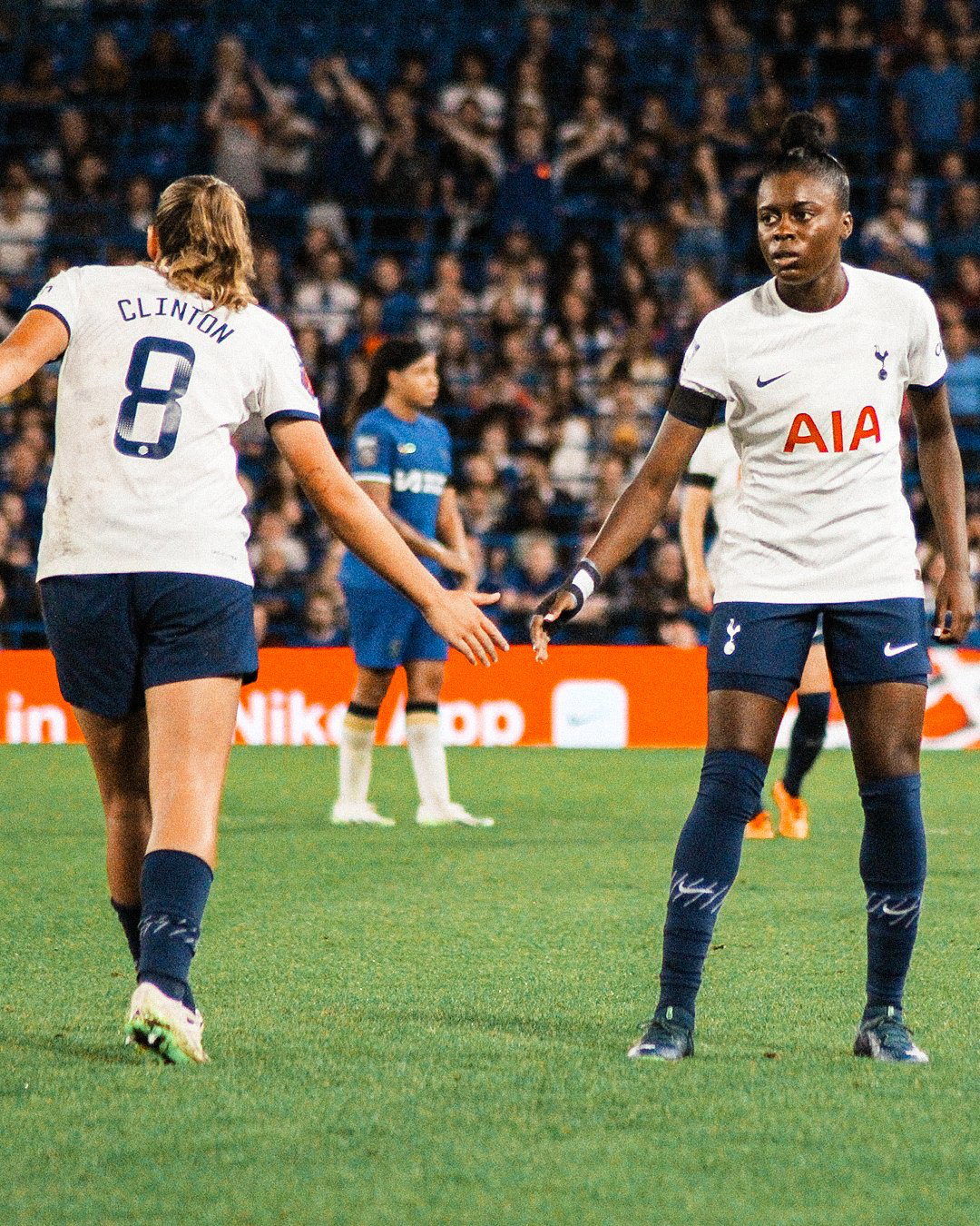 Jess Naz high-fives Grace Clinton as the latter subs off.