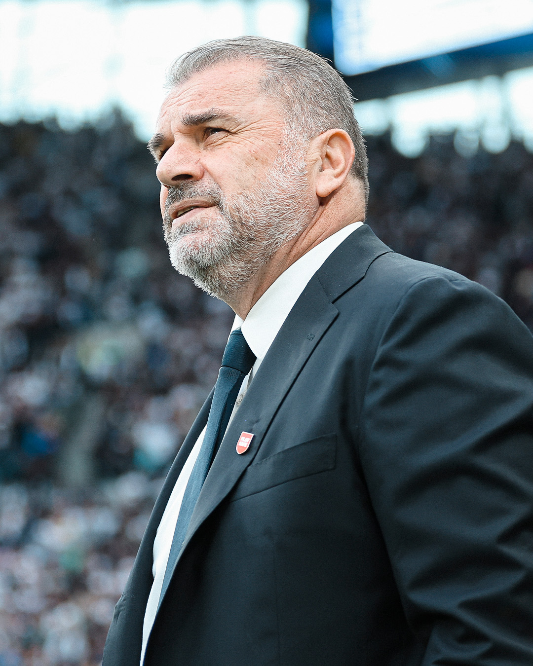 Ange Postecoglou observes the game from the touchline.