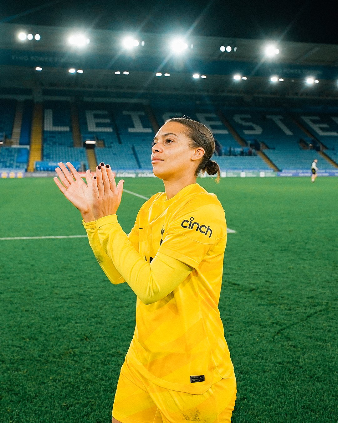 Becky Spencer claps the Tottenham away fans at the King Power Stadium.