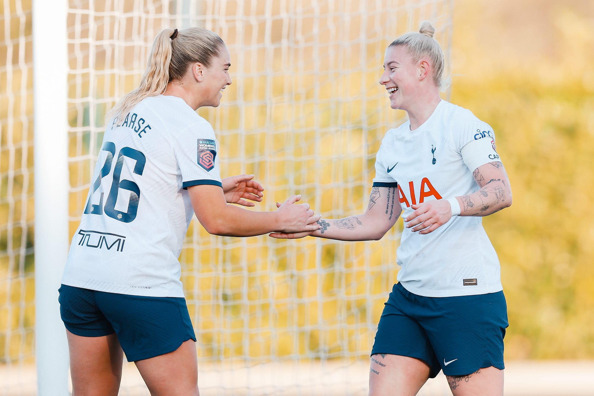 Beth England smiles and high fives Gracie Pearse.