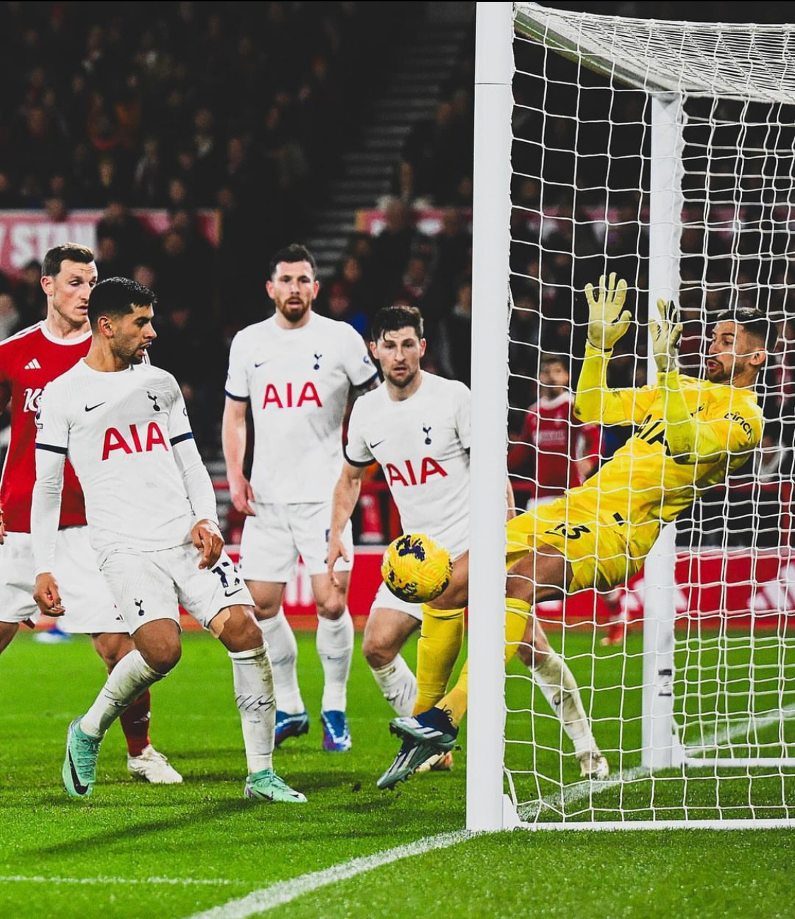 Guglielmo Vicario makes a save with his knee against Nottingham Forest.