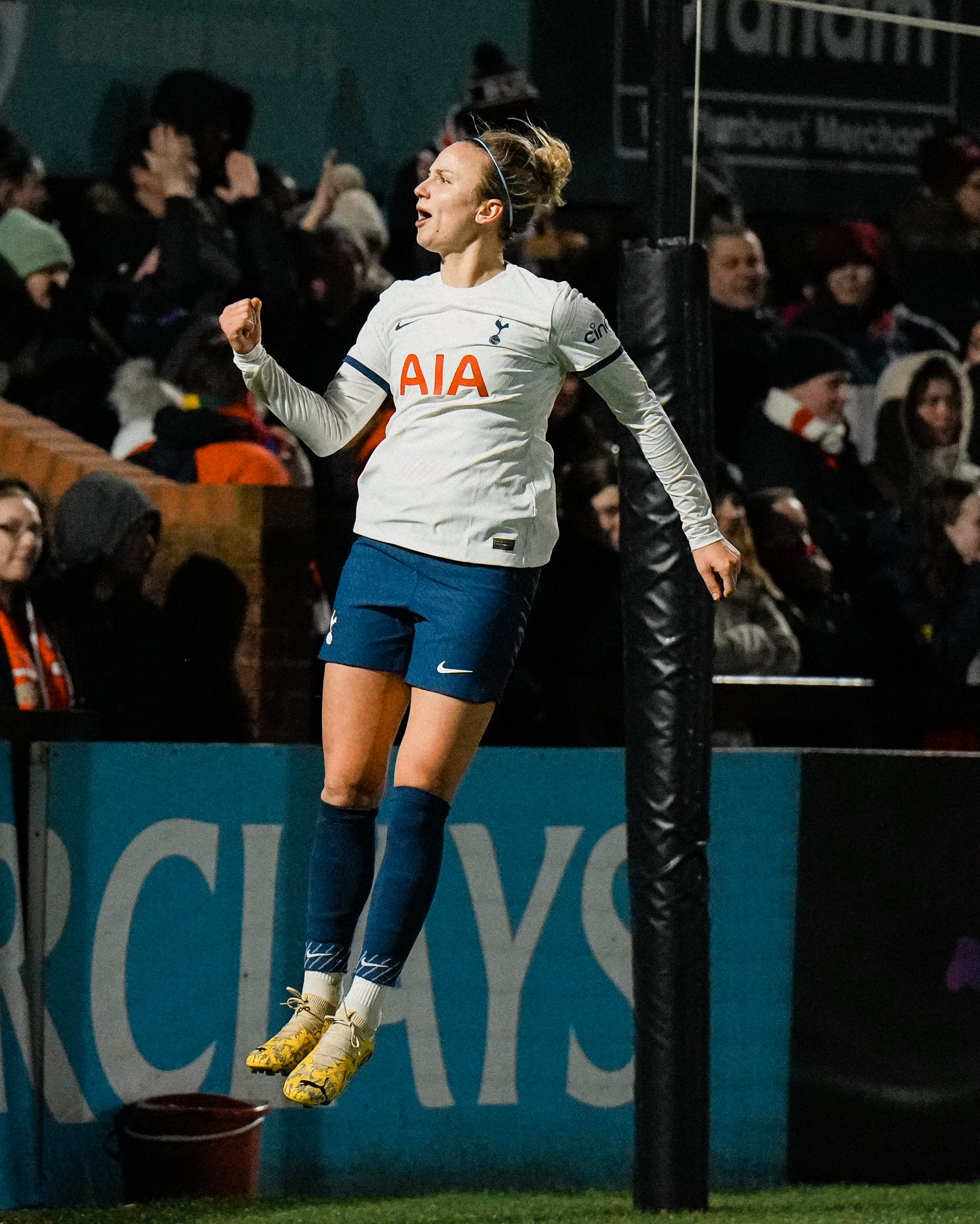 Martha Thomas jumps to celebrate her headed goal.