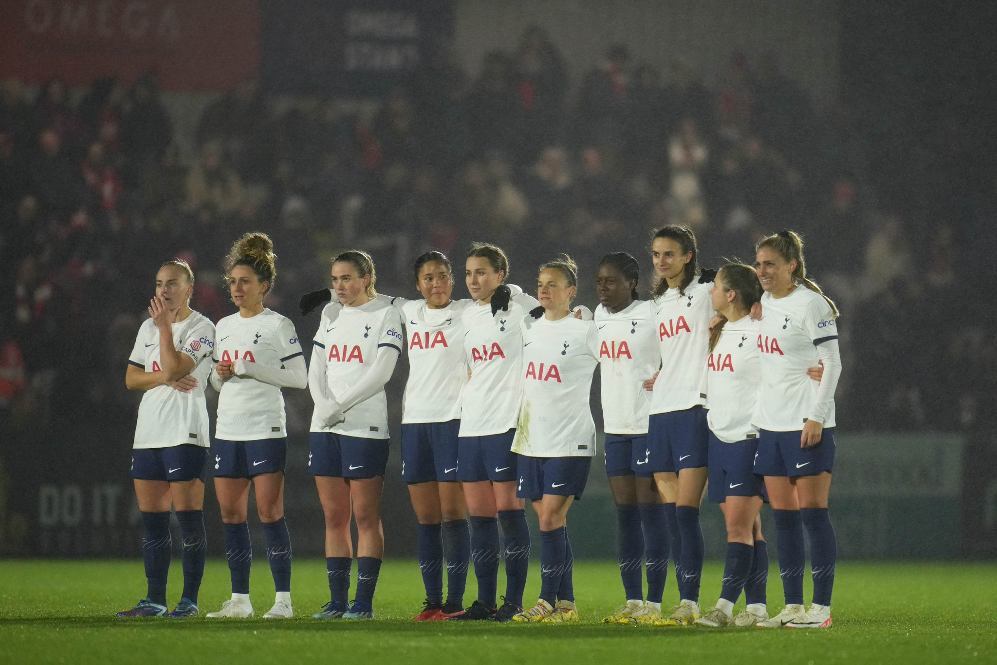 Spurs Women players line up for the penalty shootout.