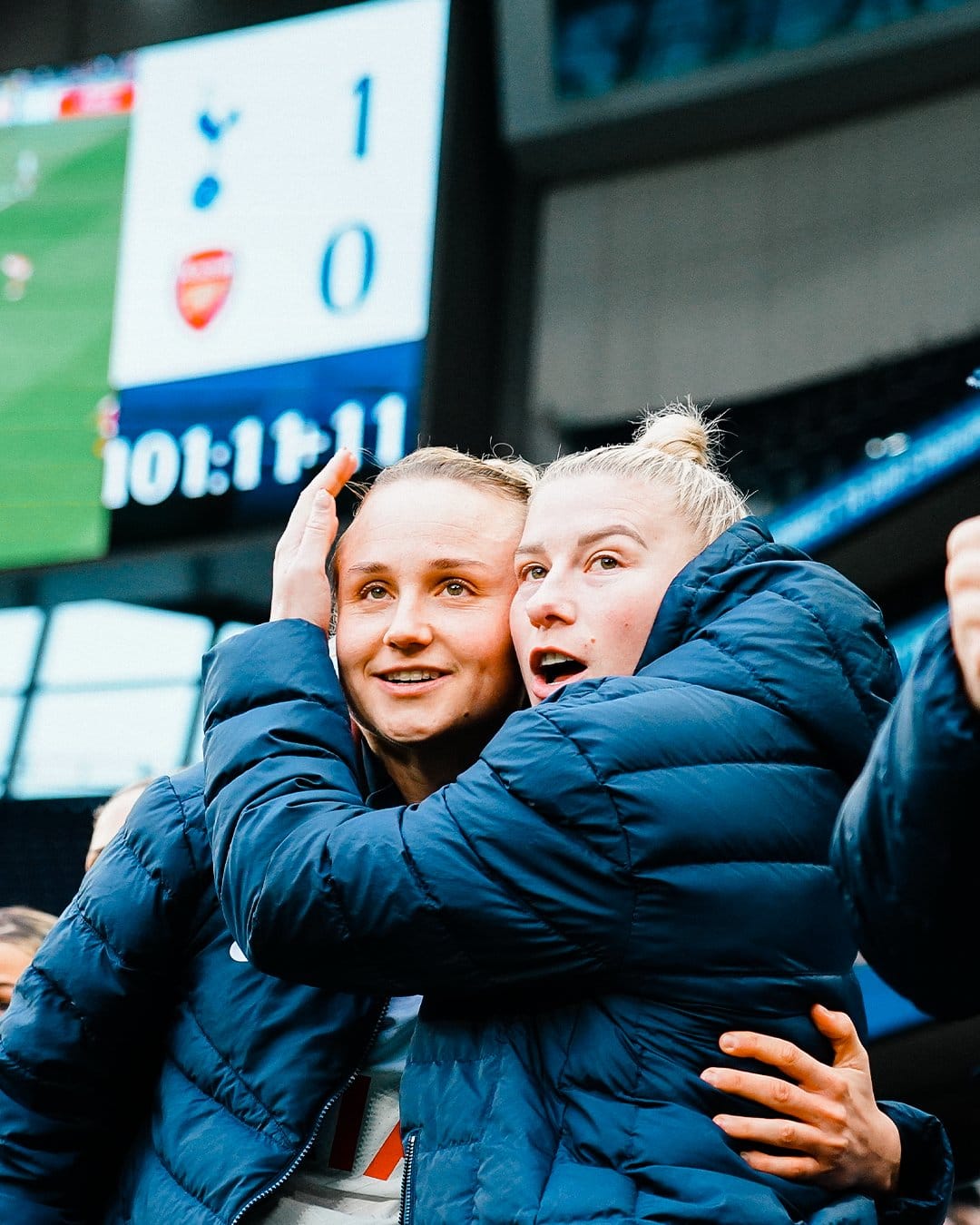 Martha Thomas and Beth England hold each other as they wait for the final whistle. 