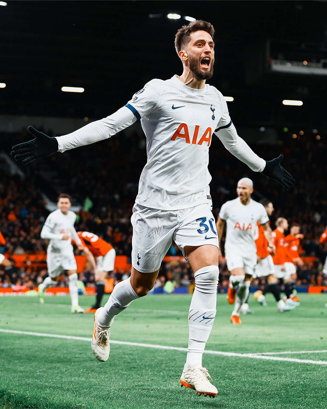 Rodrigo Bentancur spreads his arms to celebrate scoring the equalizer.