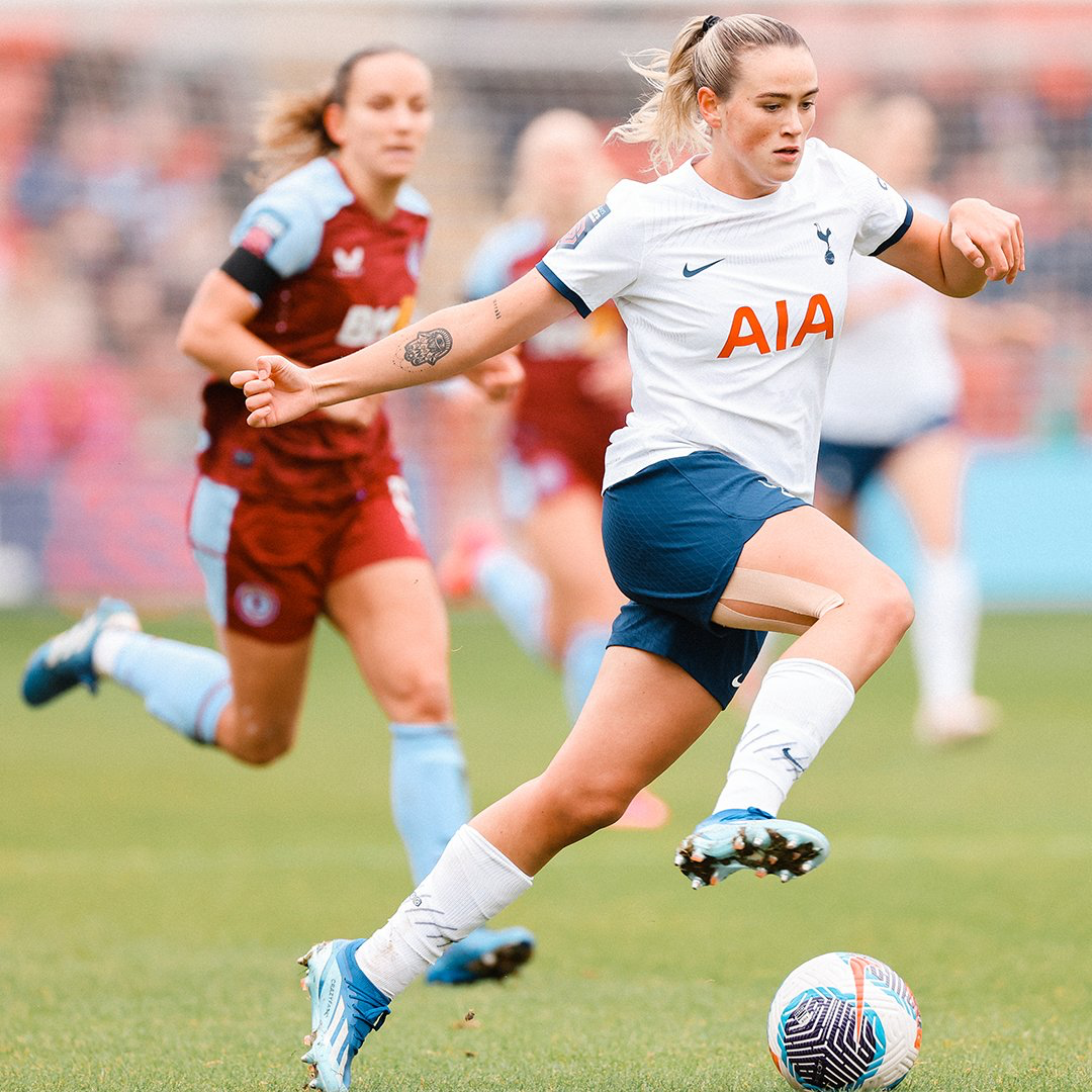 Grace Clinton dribbles the ball.