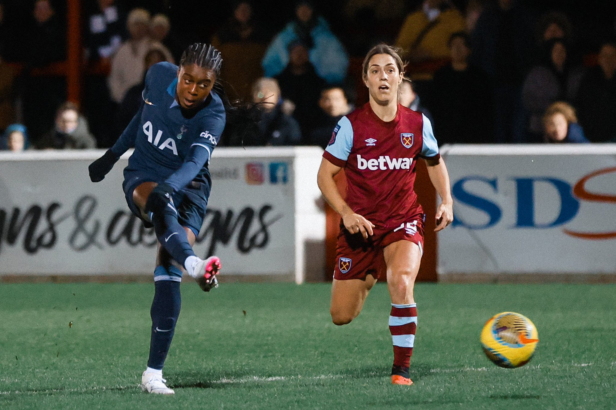 Jess Naz strikes the ball for the winning goal as Katrina Gorry looks on.