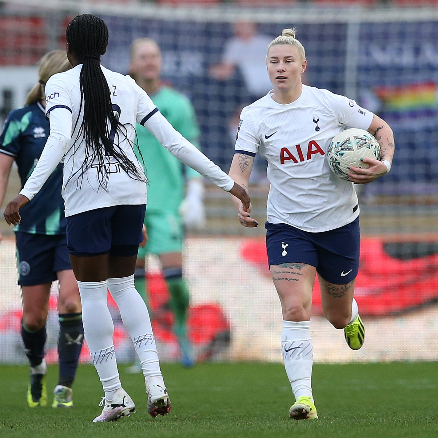 Jess Naz holds her hand out for a high five after Beth England converts the penalty she won.