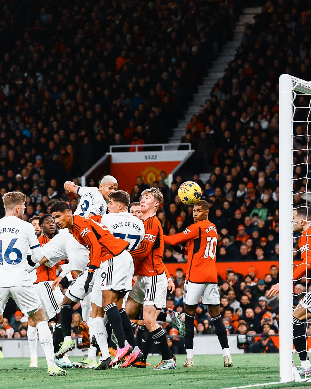 Richarlison heads the ball into the net.