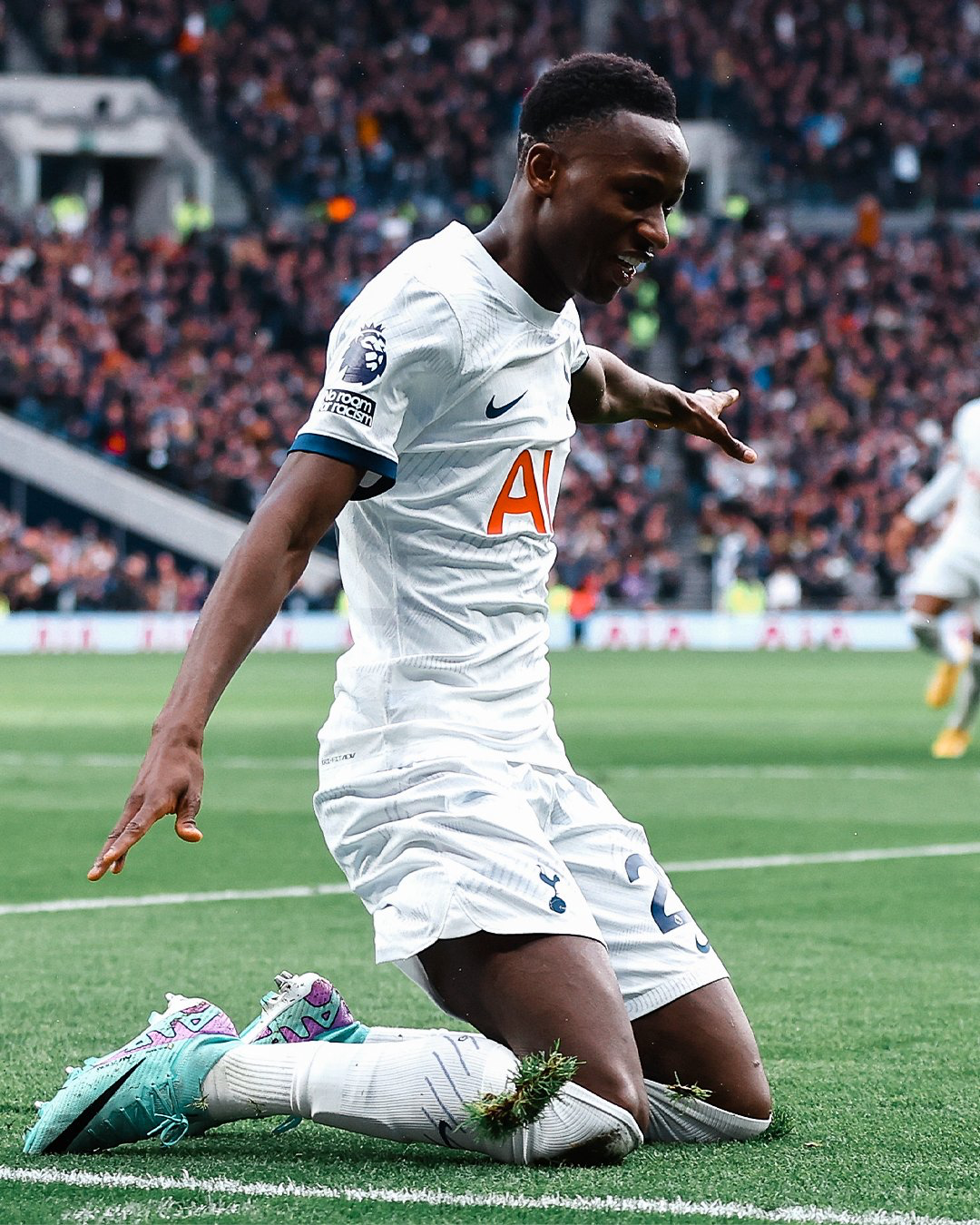 Pape Sarr does a knee slide after scoring.